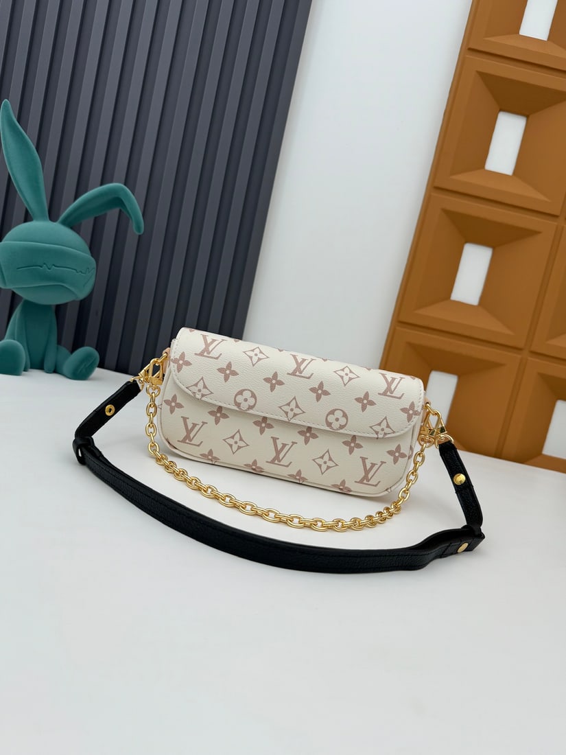 Wallet On Chain Ivy Handbag: The Wallet On Chain Ivy handbag is crafted from Monogram canvas and inspired by the Sac Recoleta handbag of the 2000s. It features a card slot and a zippered interior pocket for everyday essentials, a