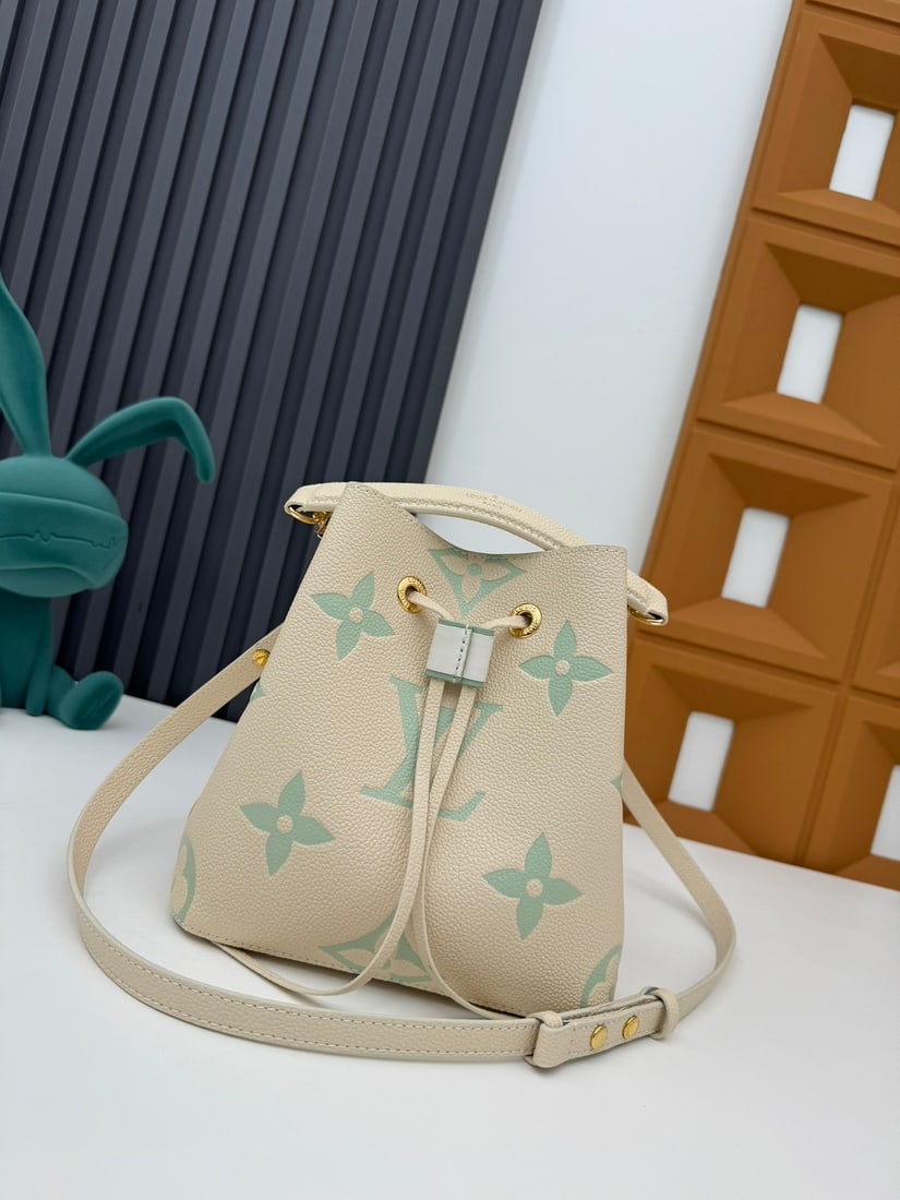 NeoNoe BB handbag: This NeoNoe BB handbag is made of Monogram Empreinte calfskin leather embossed with the LV logo and Monogram flowers. 20.0 x 20.0 x 13.0 cm (Length x Height x Width) We offer FREE SHIPPING for both