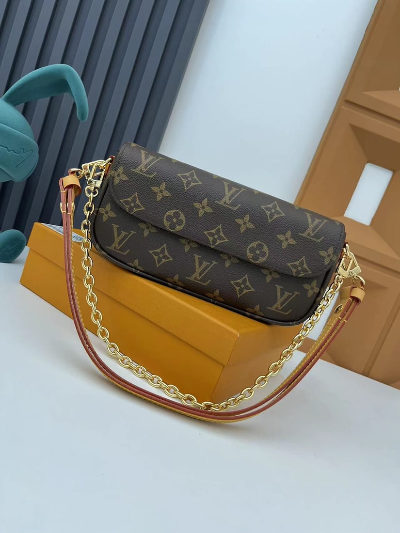 Wallet On Chain Ivy Handbag: The Wallet On Chain Ivy handbag is crafted from Monogram canvas and inspired by the Sac Recoleta handbags of the 2000s. It features a card slot and a zippered interior pocket for everyday essentials. 