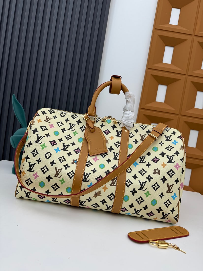 LVXYK Keepall 50: This LVXYK Keepall 50 combines classic design with iconic details. Crafted from Damier Graphite canvas, it's a carry on size. It features rounded leather handles and an adjustable, detachable