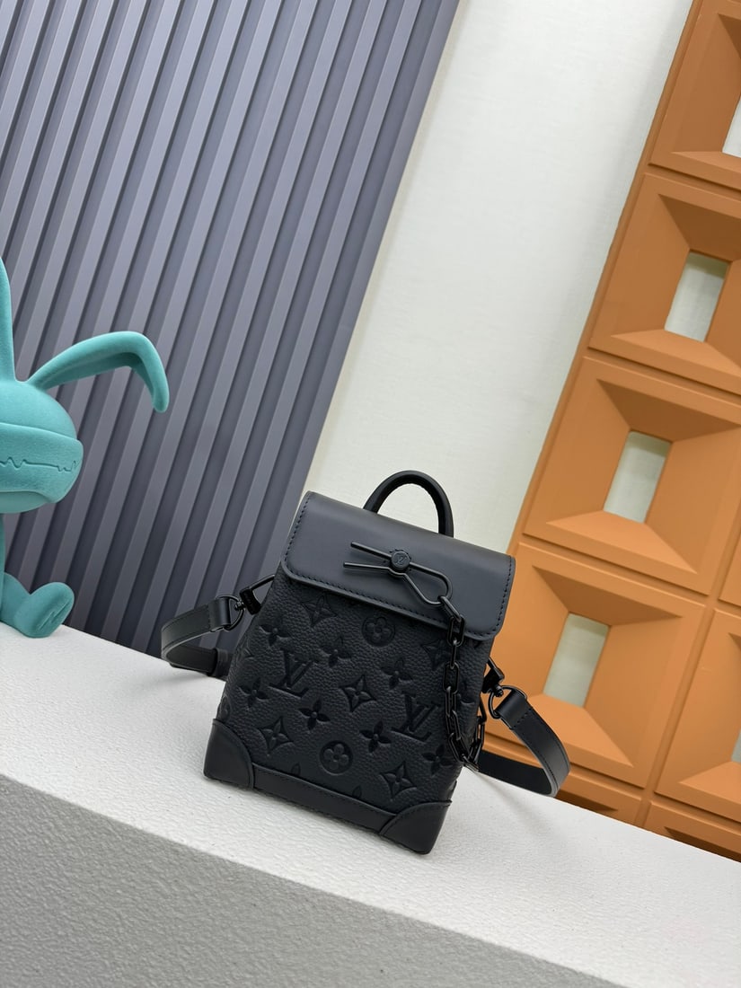Nano Steamer Bag: This Nano Steamer handbag is crafted from Monogram Eclipse canvas. It features a top handle and a detachable, adjustable chain, allowing for multiple carrying options. 15 x 18 x 7 cm We offer FREE SHI