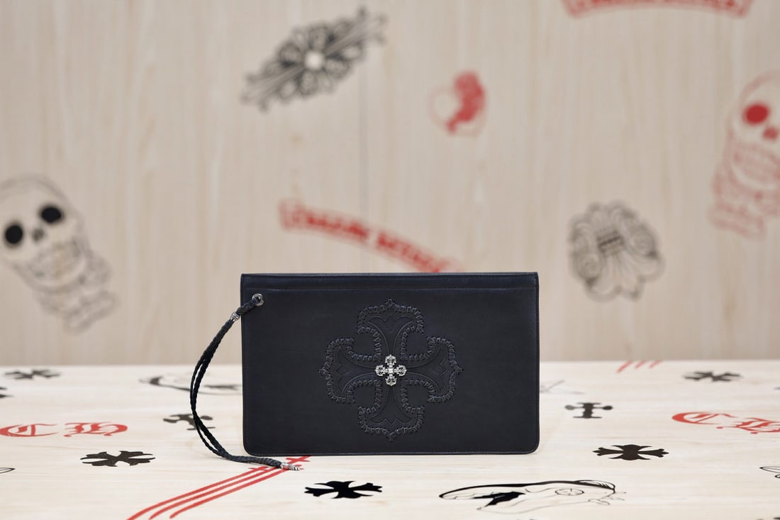 Chrome Hearts Cross Patterned Clutch: Chrome Hearts Cross Patterned Leather Clutch Bag, made of durable and practical cowhide, suitable for everyday use. The distressed 925 sterling silver hardware and guilloch?? logo add a unique touch. 
