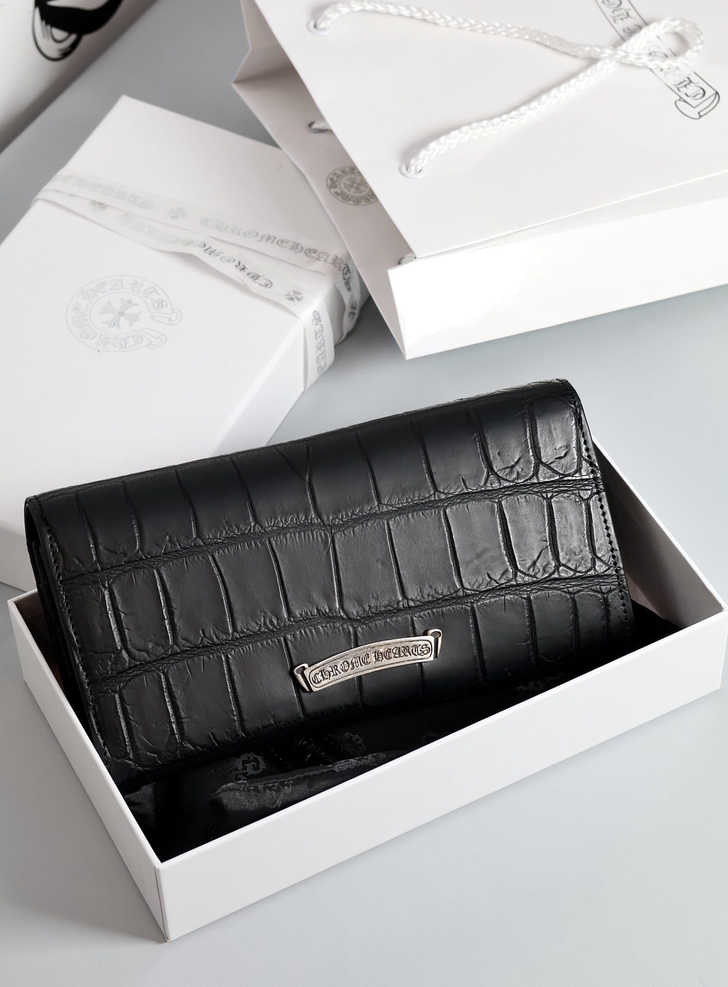 Chrome Hearts Long Flip Wallet: Chrome Hearts Long Flap Wallet, Model: WE100. Material: Crocodile leather, cowhide, sword patterned jacquard lining. Dimensions: 21 x 10.5 x 3.5 cm. Structure: 2 bill compartments, 12 card slots, 5 hi