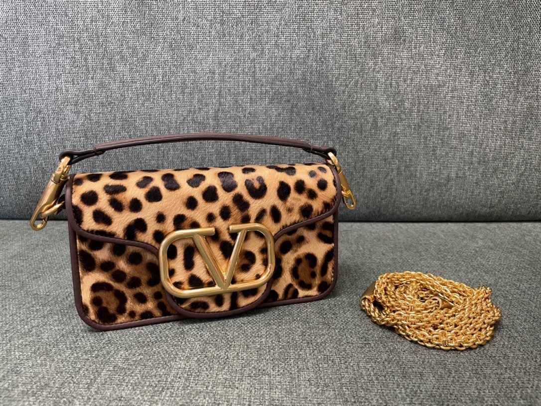Valentino: Valentino calfskin handbag with leopard print and vintage brass finish, featuring a magnetic closure and soft lambskin lining. We offer FREE SHIPPING for both domestic and international clients.We acc