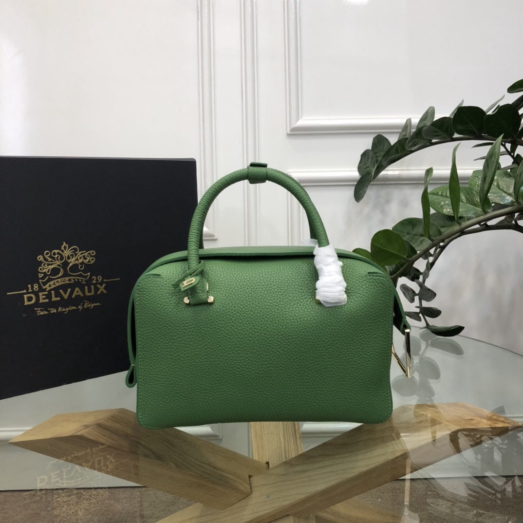 Delvaux: The most striking feature of the Delvau semi handcrafted Cool Box is its unique D shaped pull tab and cubic structure. Unlined, the Cool Box offers ample interior space, is lightweight, and highly