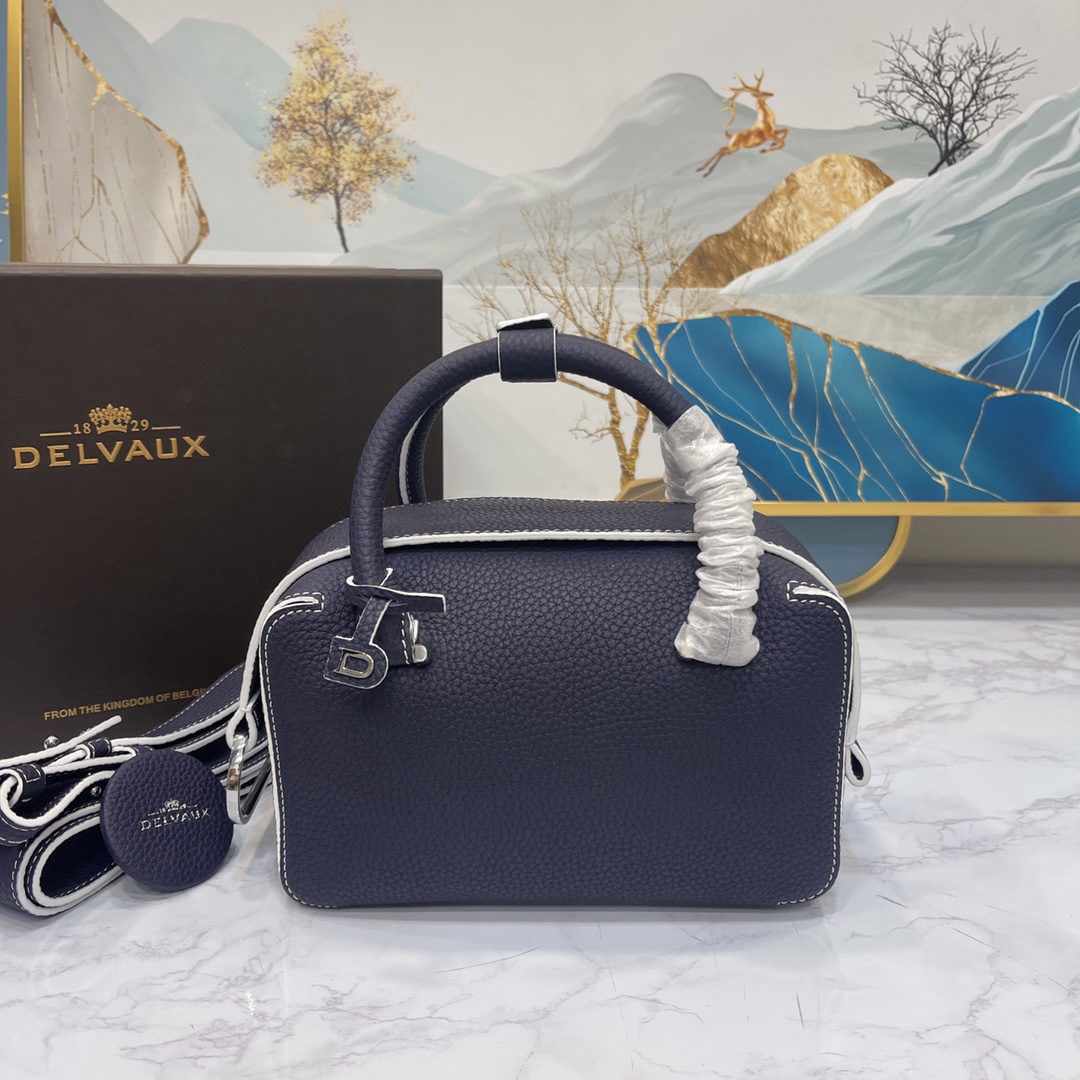 Delvaux: The indigo blue mini Cool Box is youthful and modern, a trendsetter. Its casual, lightweight, and comfortable design embodies a unique spirit, combining beauty and practicality. The Cool Box Mini is p