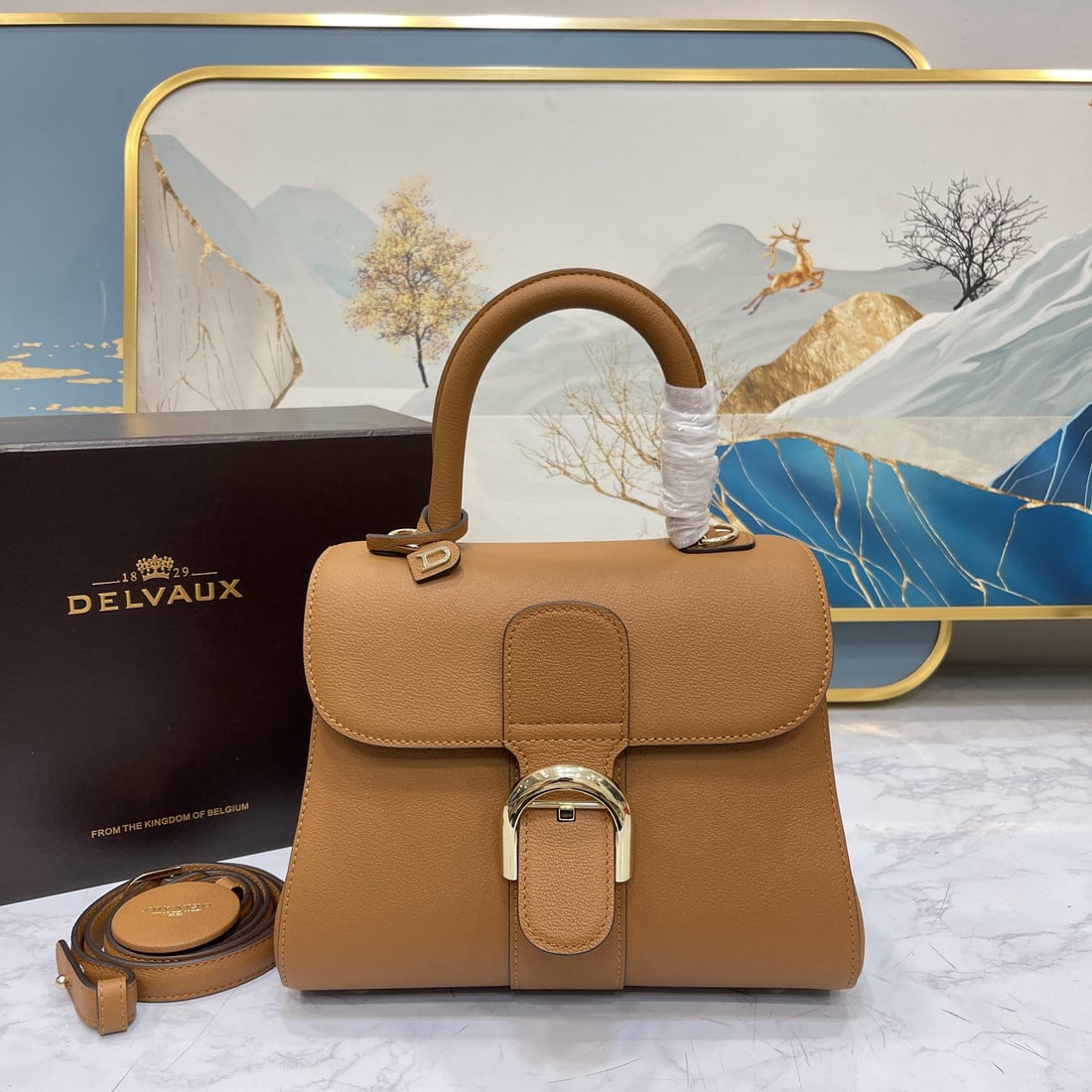 Delvaux: New PM togo leather caramel Belgian Delvaux Brillant classic bag! Adorned with select Rodeo Calf grain calfskin, the Brillant PM bag stands out for its clean leather cut and elegant, flowing lines, fe