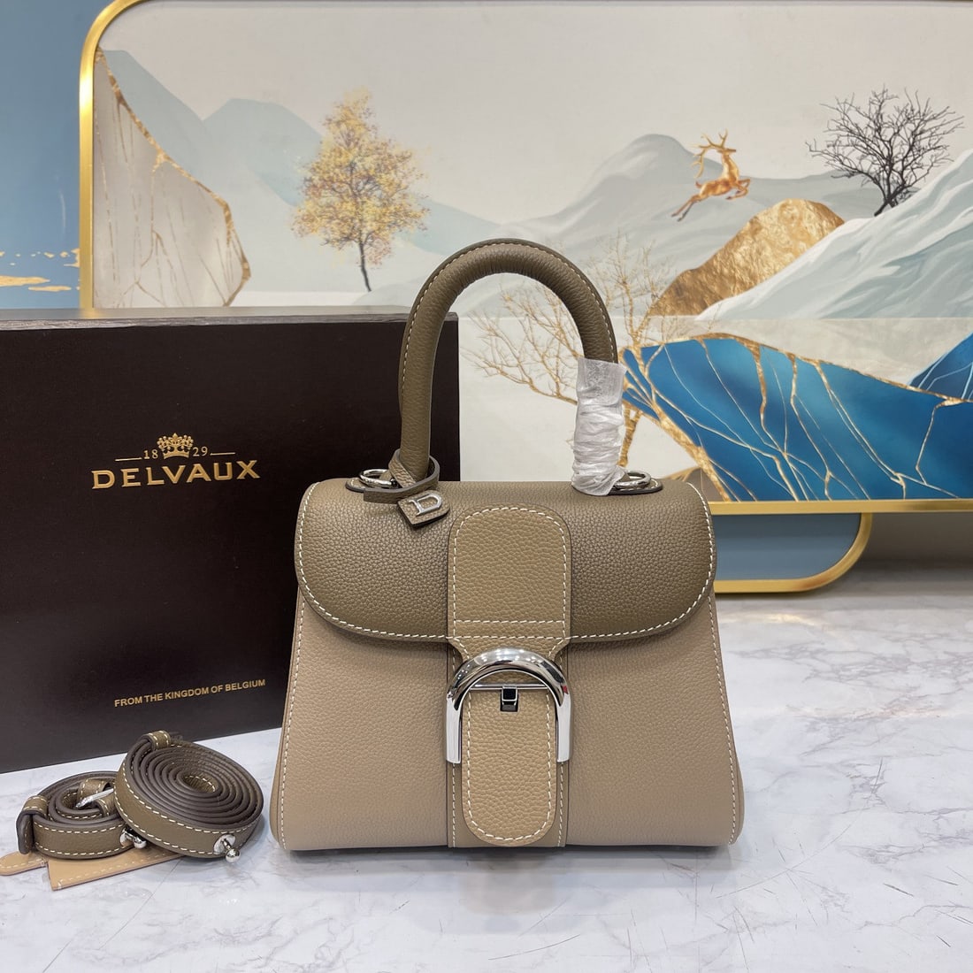 Delvaux: As one of Delvaux's most acclaimed pieces, the Brillant handbag is crafted from select calfskin leather, featuring the iconic "D" hardware and exquisite handcraftsmanship. Its S shaped silhouette exud