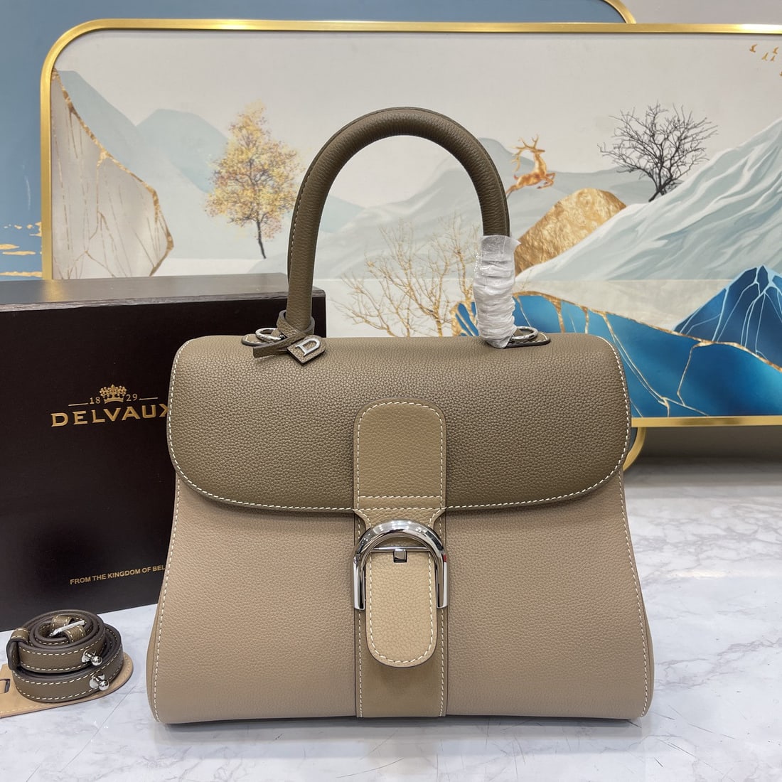 Delvaux: As one of Delvaux's most acclaimed pieces, the Brillant handbag is crafted from select calfskin leather, featuring the iconic "D" hardware and exquisite handcraftsmanship. Its S shaped silhouette exud