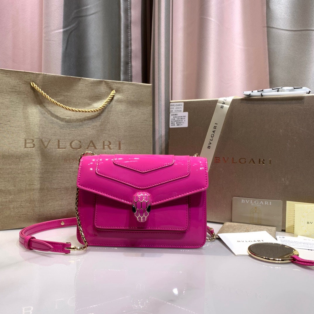 Bvlgari Serpenti Forever: The Serpenti Forever crossbody bag is stylish and versatile. This bag is crafted from glossy, pearlescent garnet red calfskin, adorned with burgundy enamel and black onyx accents. The sensual eyes on 