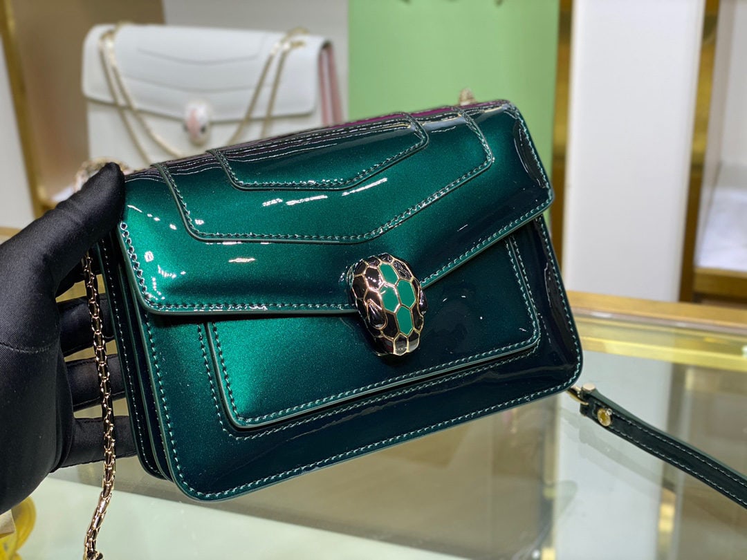 Bvlgari Serpenti Forever: The Serpenti Forever crossbody bag is stylish and versatile. This bag is crafted from emerald green calfskin with a pearlescent lacquer finish, adorned with matte green enamel accessories and black on
