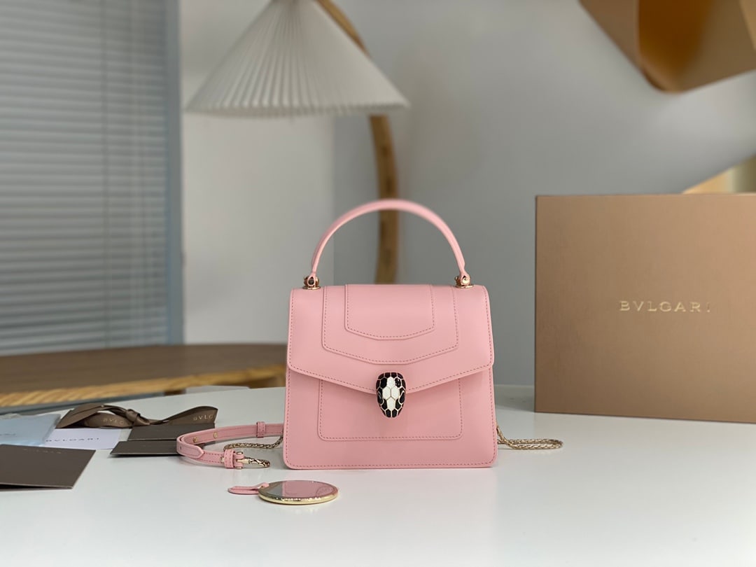 Bvlgari Serpenti Forever: The Serpentine Forever handbag reinterprets timeless style in fresh and charming colors, blending modern style with versatile appeal. This cherry blossom pink calfskin bag with a malachite snakeskin h