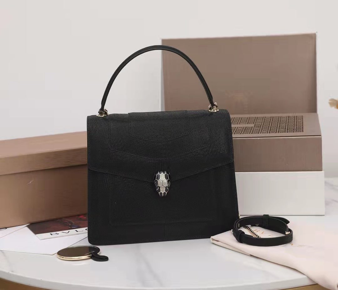 Bvlgari SERPENTI FOREVER: The Bvlgari SERPENTI FOREVER collection is crafted from precious black metallic calfskin, featuring shimmering charcoal black diamond and bright silver enamel scales paired with black onyx sensual eye