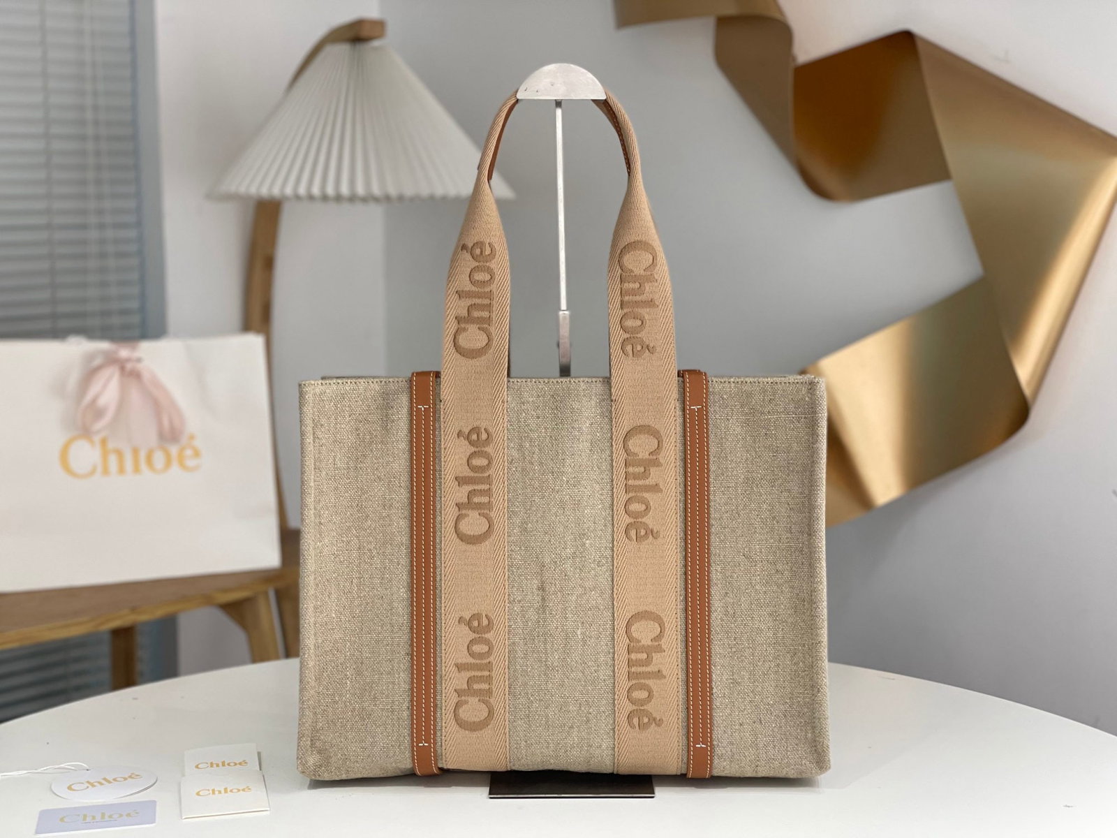 Chloe Woody: Chloe's Spring/Summer Woody Tote collection is a sweet caramel milk tea color. The ribbon is a pure cotton orange pink, and the logo, still embroidered, shines brightly within the orange hue. We