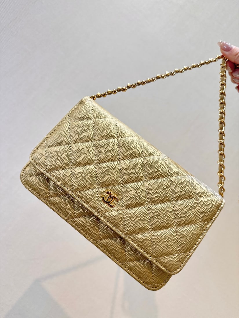 CHANEL Classic Flap WOC Chain Bag: The Classic Flap WOC chain mini bag is a super classic piece that requires minimal effort to style ?C just grab it and go! While the chain isn't detachable, it offers several different ways to wear