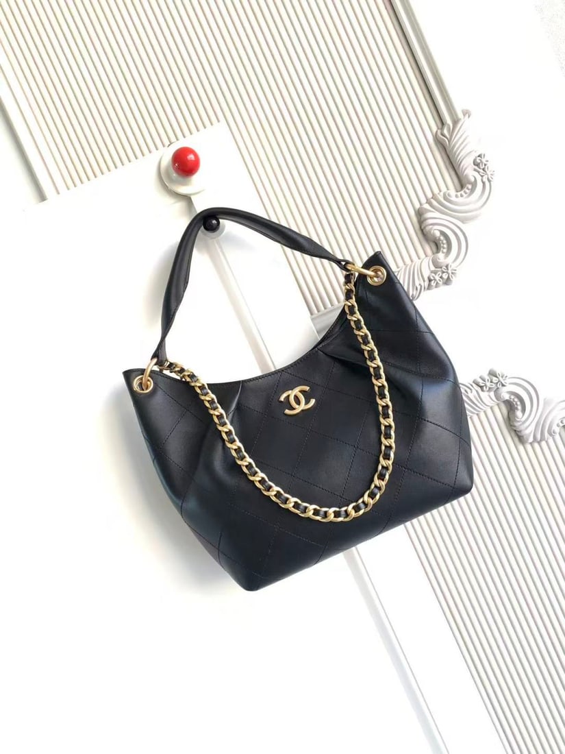 CHANEL Early Spring Collection Hobo Hippie Bag: CHANEL's early spring collection hobo bag features a delicate, short pile texture that is soft and skin friendly. The vintage gold tone metal chain adds a touch of retro elegance, while the matching c