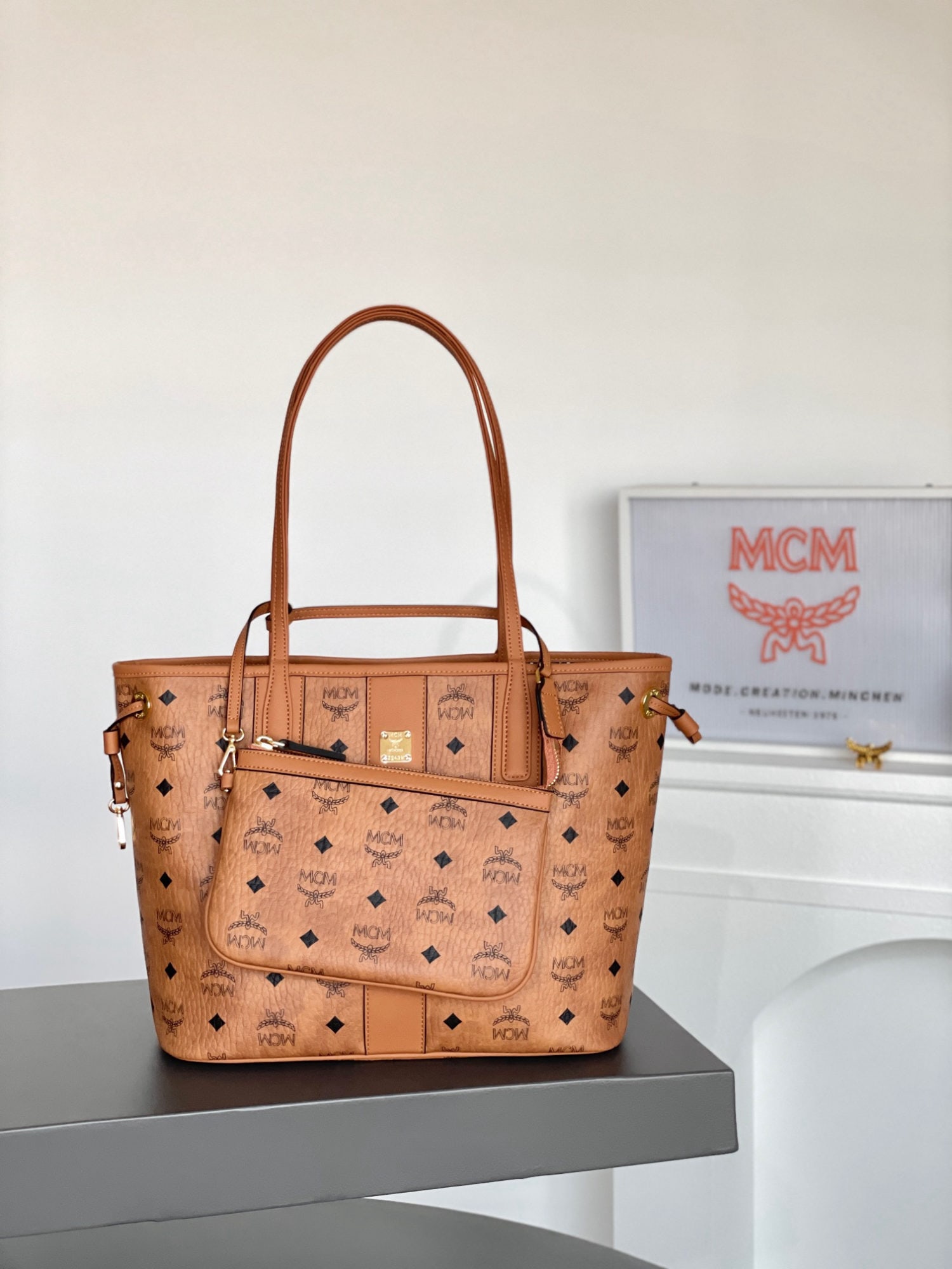 MCM Liz Visetos Small Reversible Shopping Bag Mother Bag: MCM Liz Visetos Small Reversible Shopping Bag Mother Bag in Classic Cognac Color. This is a signature two-in-one item. The petite Liz bag features a double-sided Cubic cotton canvas design, showcasing