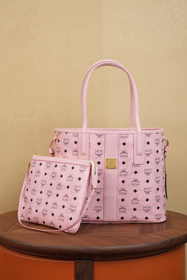 MCM Liz Visetos Medium Reversible Shopping Bag: The MCM Liz Visetos Medium Pink Reversible Shopping Bag (Soft Pink) is a well-known international handbag. This iconic Liz shopping bag features a soft pink hue, exuding a serene and sophisticated cha