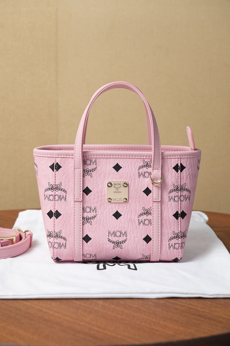 mcm toni visetos x-mini shopping basket: MCM Toni Visetos X-Mini Shopping Basket in New Pink - Can be worn as a shoulder bag or crossbody. This Toni shopping bag features a unique geometric design enveloped in a serene and sophisticated new 