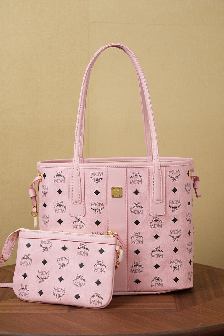 MCM Liz Visetos Mini Reversible Shopping Bag: MCM Liz Visetos Mini Reversible Shopping Bag in Peach Blossom Pink - Upgraded to a New Peach Blossom Pink. This small shopping bag is crafted from the classic Visetos, continuing the traditional elega