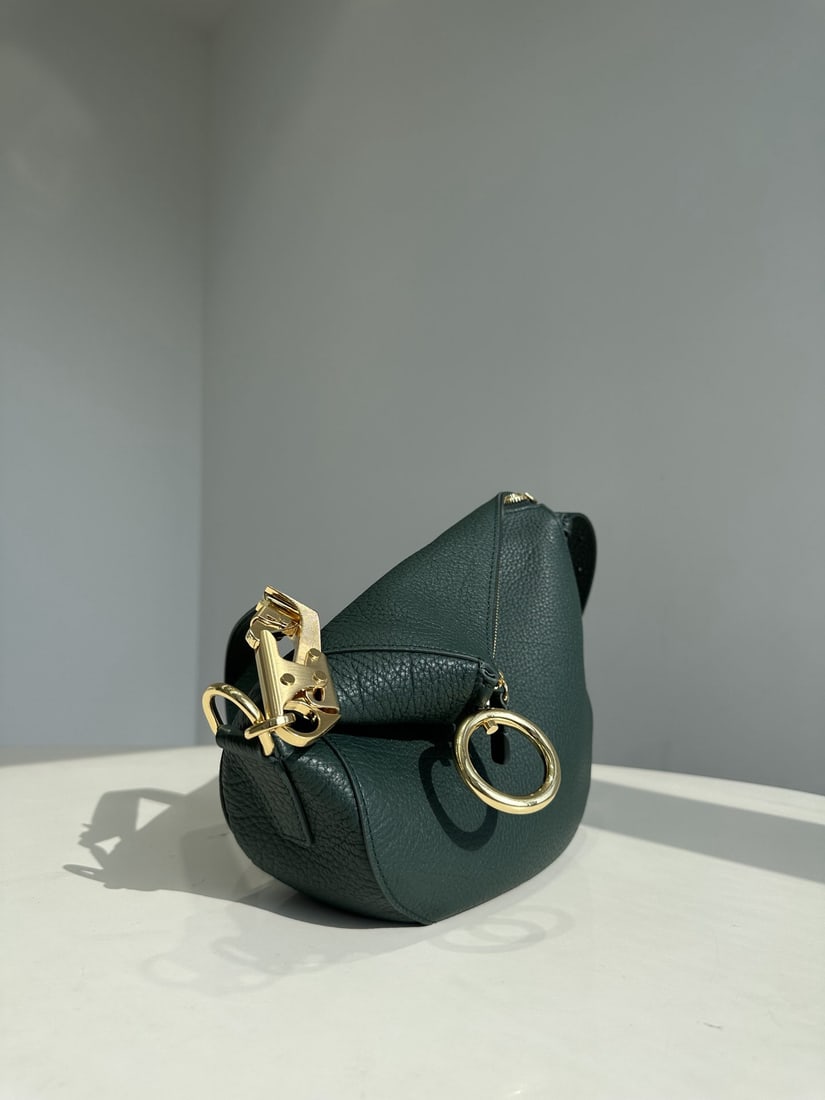 Burberry: The Burberry Knight shoulder bag is inspired by the Equestrian Knight emblem (EKD). Crafted from custom Italian pebbled calfskin, the leather is soft, lustrous, and features a clear grain, offering