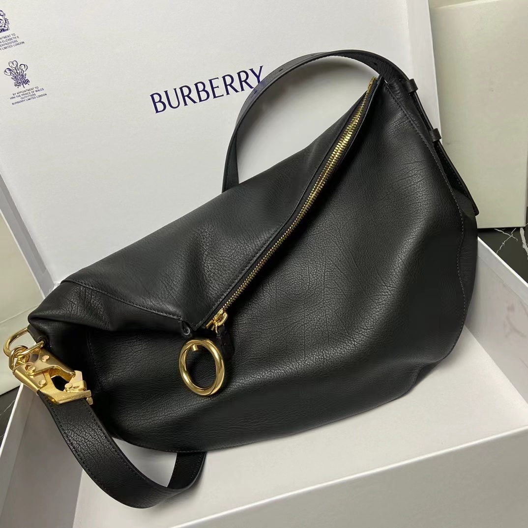 Burberry Knight: This medium-sized Knight bag is crafted from natural grain calfskin leather in Italian workshops, featuring a soft yet structured design. It includes a hook-and-loop closure that playfully