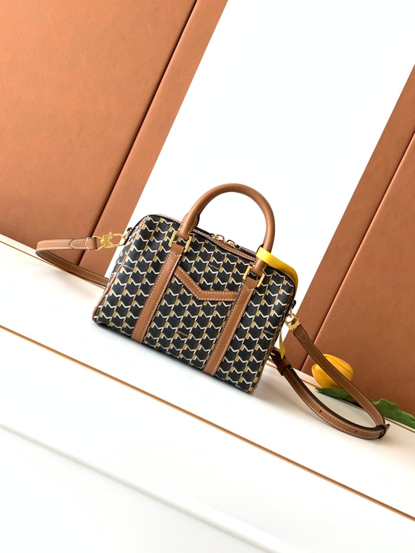 Moynat Canvas 48H Travel Bag: The Canvas MINI 48H Travel Bag is a perfectly scaled-down version of the 48H M travel bag, capable of holding all your daily essentials. It retains the patch pocket with the "M" shaped cutout on the f