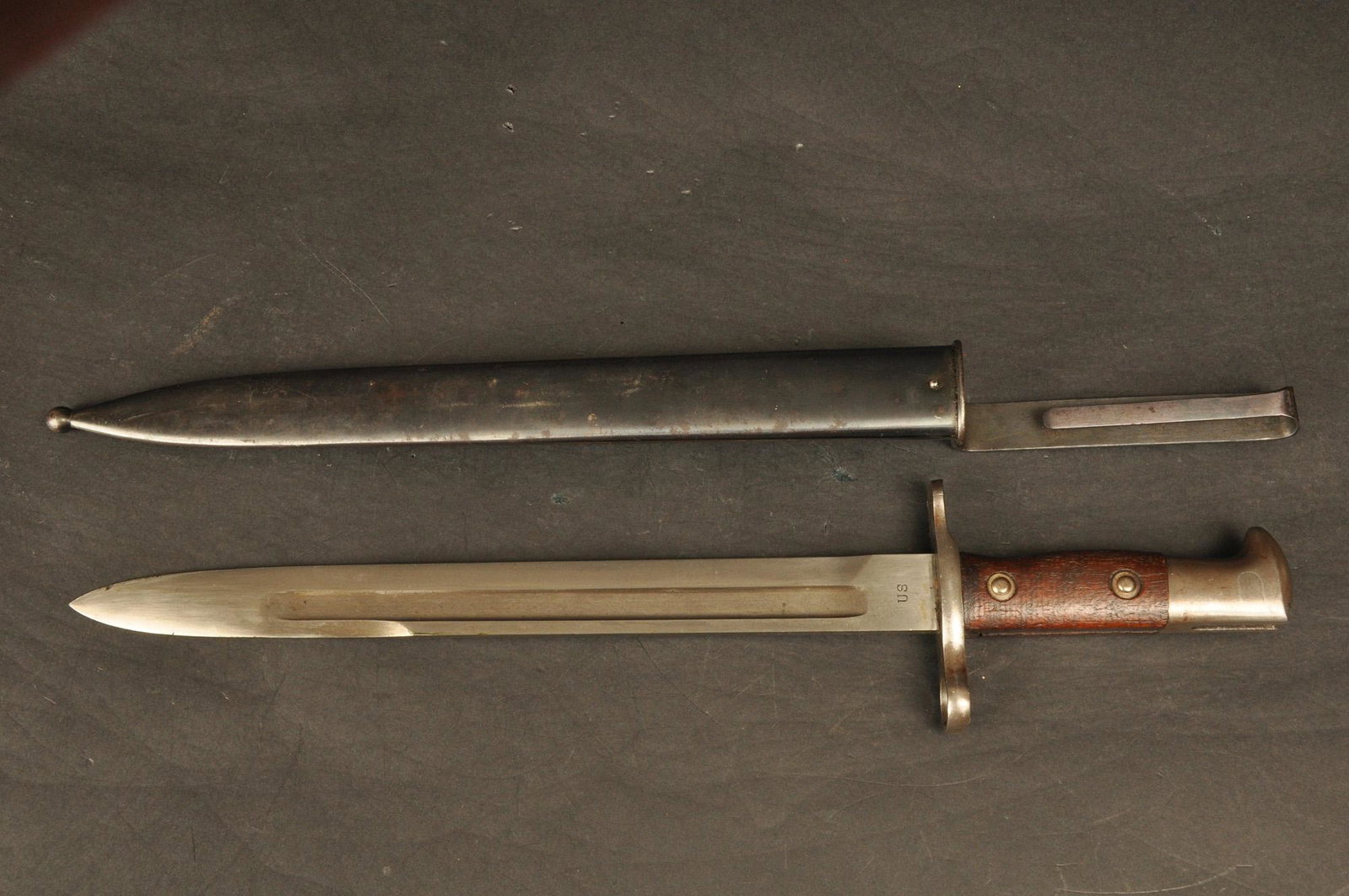 Bayonet: U.S. Krag Model w/scabbard mkd. US & dated 1900. 11.75" Blade, 16.25" OAL.