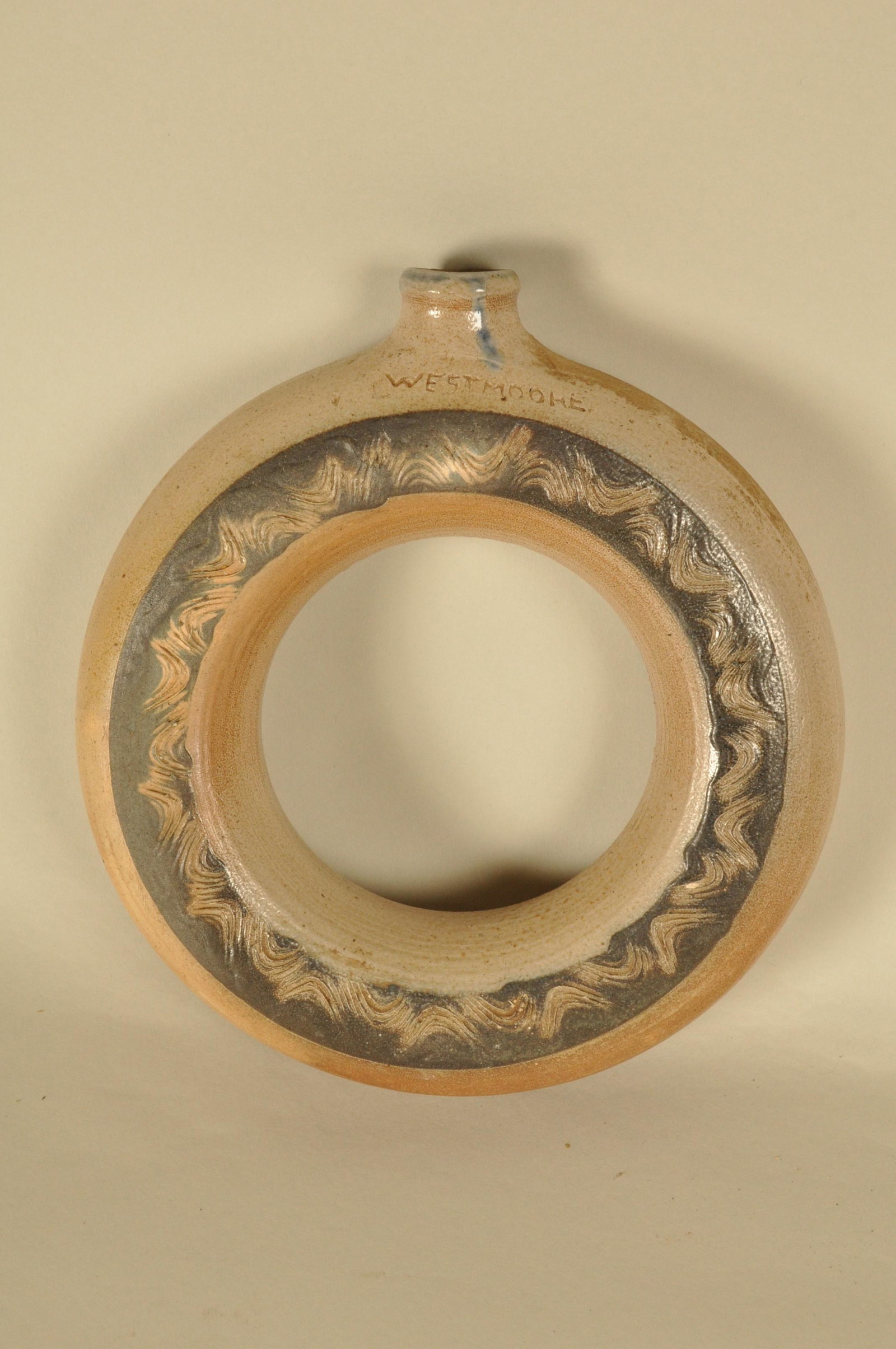 Circular Stoneware Flask: Incised "Westmoore" Incised Cobalt circle dec. 8.5 in. dia.