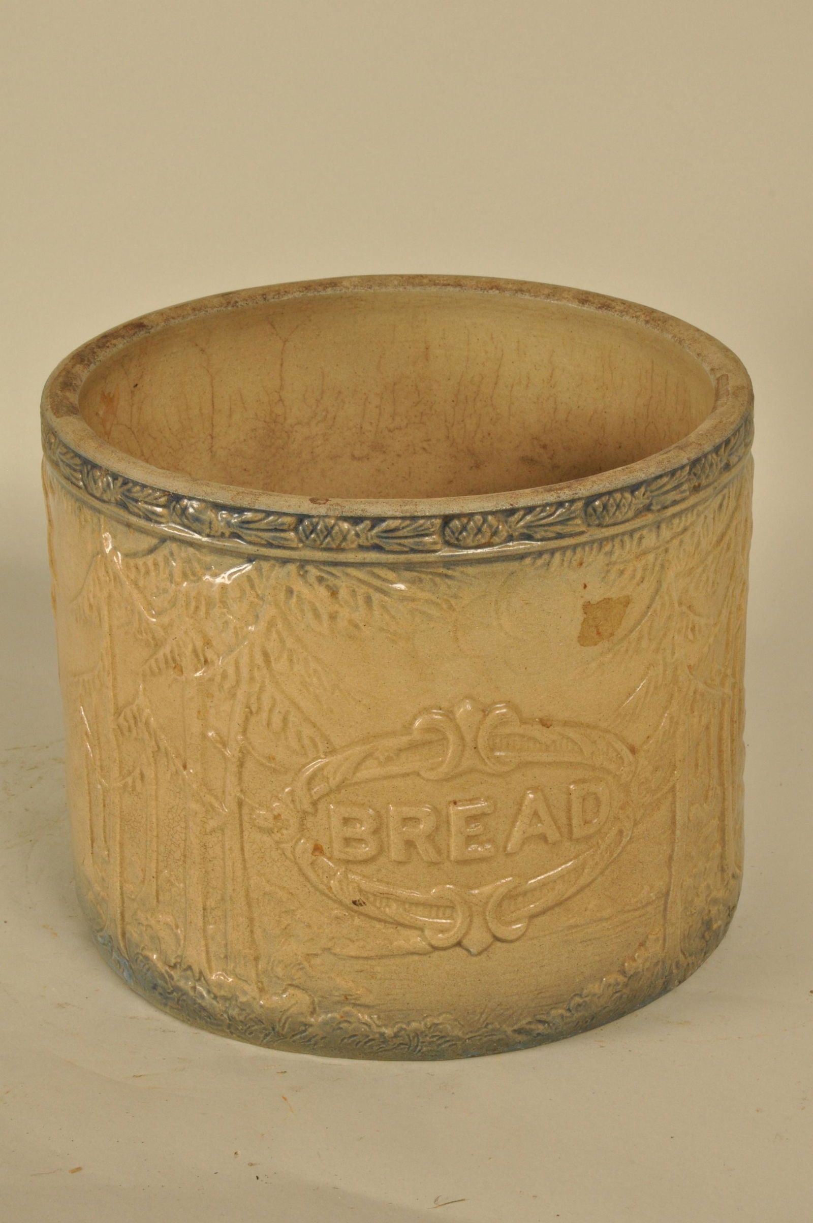 Stoneware Bread Crock: Cobalt rimmed and raised pine tree pattern 10.5 in. H x 10.5 in. dia