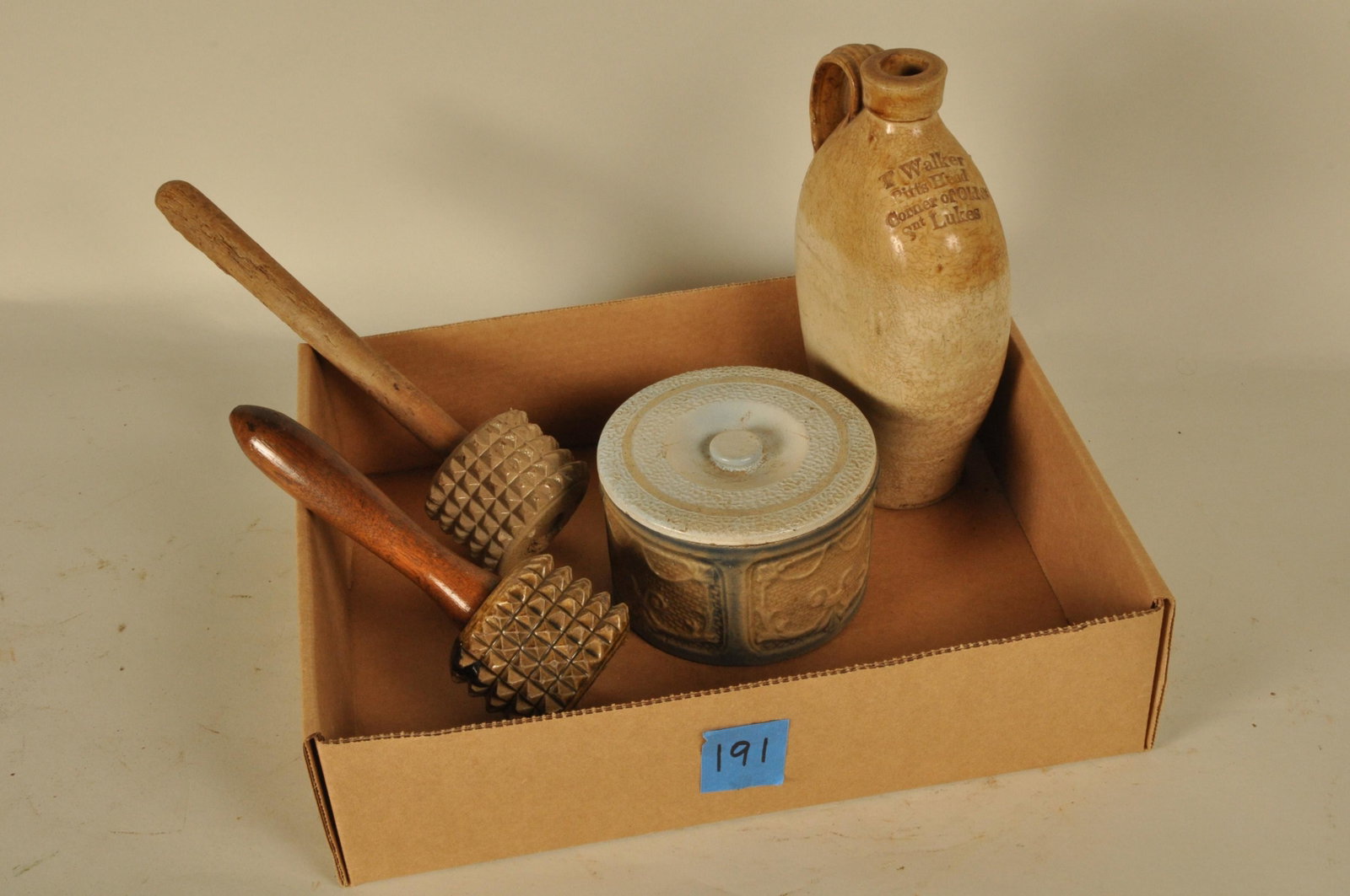 Box Lot of Misc. Stoneware: Four (4) pcs: 1 "T. Walker" liquor jug, 2 meat tenderizers, 1 butter crock