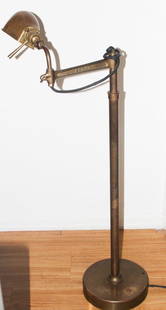 RALPH LAUREN VINTAGE ADJUSTABLE BRASS FLOOR LAMP: RALPH LAUREN VINTAGE ADJUSTABLE BRASS FLOOR LAMP. ORIGINAL PRICE $1600. EARLY TRADEMARK ESTABLISHED 1967. CIRCULAR BASE. Perfect for a painting.