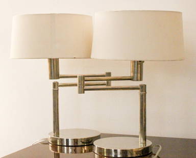 PAIR OF RALPH LAUREN ADJUSTABLE TABLE LAMPS: A MATCHING PAIR OF RALPH LAUREN adjustable swinging CHROME desk lamps with adjustable arms, round bases and white linen shades. Purchased for 1500ConditionVery Nice. Shades show some age. Tested and W