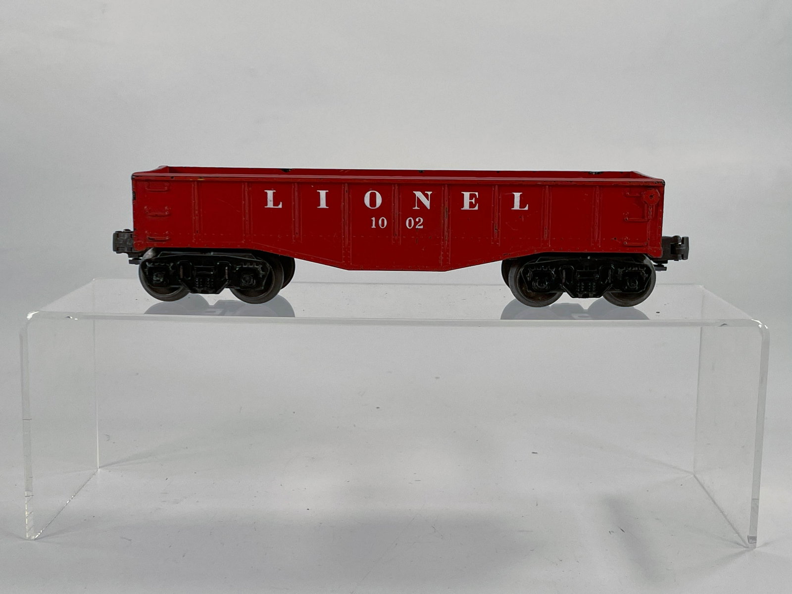 Lionel Postwar #1002 Brown Rust Gondola: Lionel Postwar #1002 Brown Rust Gondola, in C7 minus (with some paint scratches- see pictures).