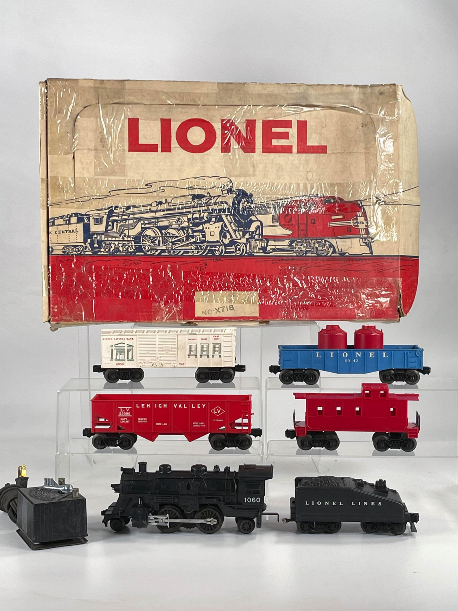 Lionel Postwar #X716 Set- 1060 Freight Set: Lionel Postwar #X716 Set- 1060 Freight Set, with #1060 Loco/Tender in C7 plus, along with four freight cars in C7 plus overall. The set box has considerable wear and some tape repairs (see pictures).