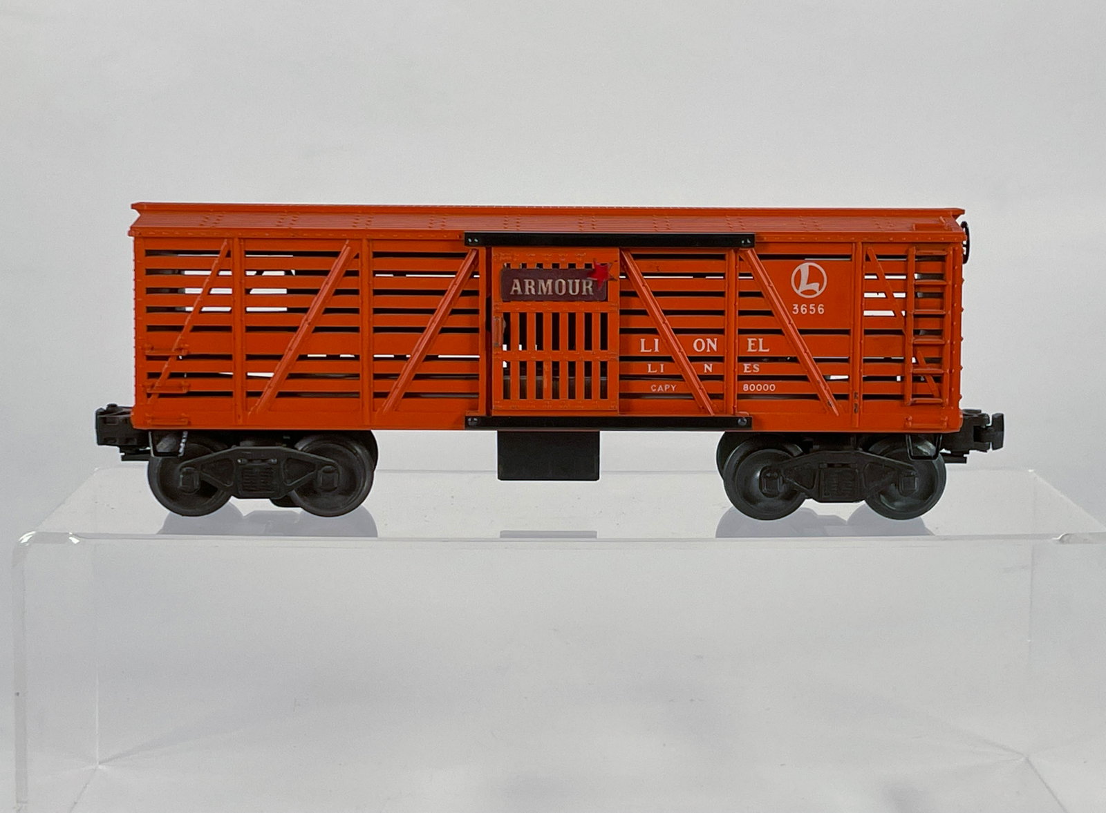 Lionel Postwar #3656 Orange Livestock Car: Lionel Postwar #3656 Orange Livestock Car, in C7 plus.
