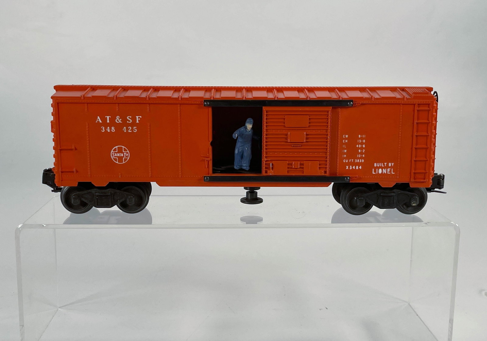 Lionel Postwar #3484 AT & SF Orange Boxcar: Lionel Postwar #3484 AT & SF Orange Boxcar, in C7 plus.