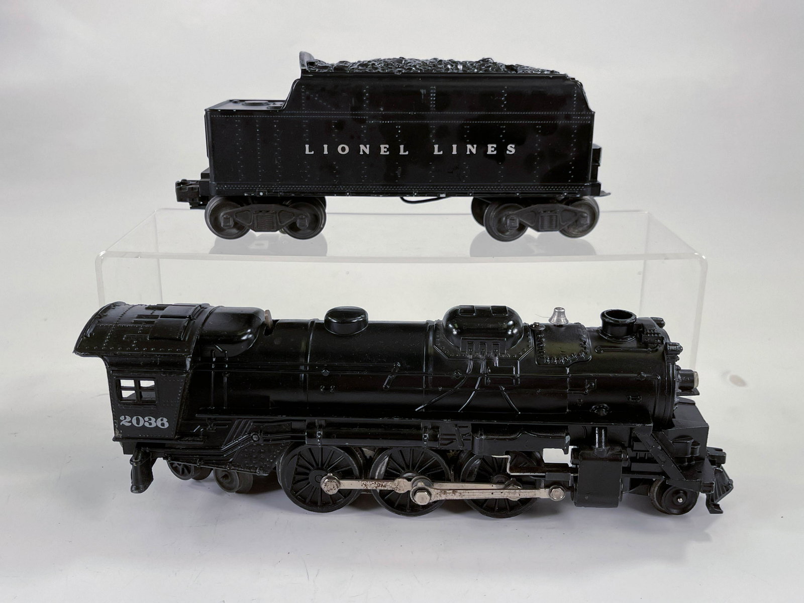 Lionel Postwar #2036 Black Locomotive and #6466W Black: Lionel Postwar #2036 Black Locomotive and #6466W Black Lionel Lines Tender, with Loco and Tender both in overall C7.