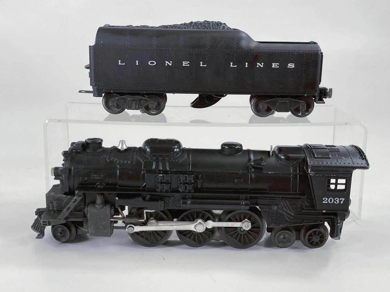 Lionel Postwar #2037 Black Loco and #2046W Black Lionel: Lionel Postwar #2037 Black Loco and #2046W Black Lionel Lines Tender, with Loco and Tender in overall C7.
