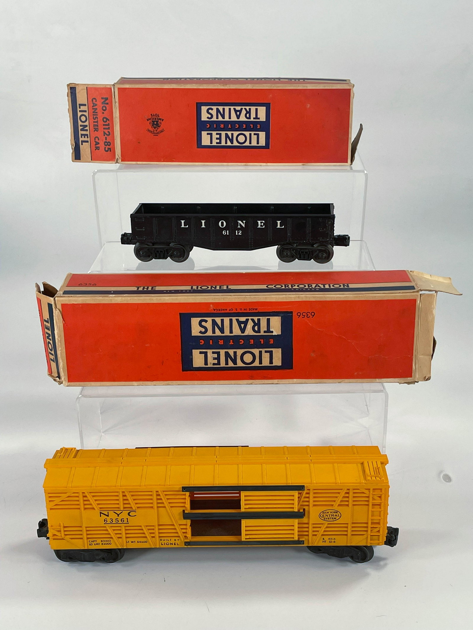 Lionel Postwar #6112-85 Cannister Car with Original Box: Lionel Postwar #6112-85 Cannister Car with Original Box and #63561 Stock Car with Original Box and #63561 in C7 plus with original box missing one end, and #6112-85 in C7 with no cannisters and origin