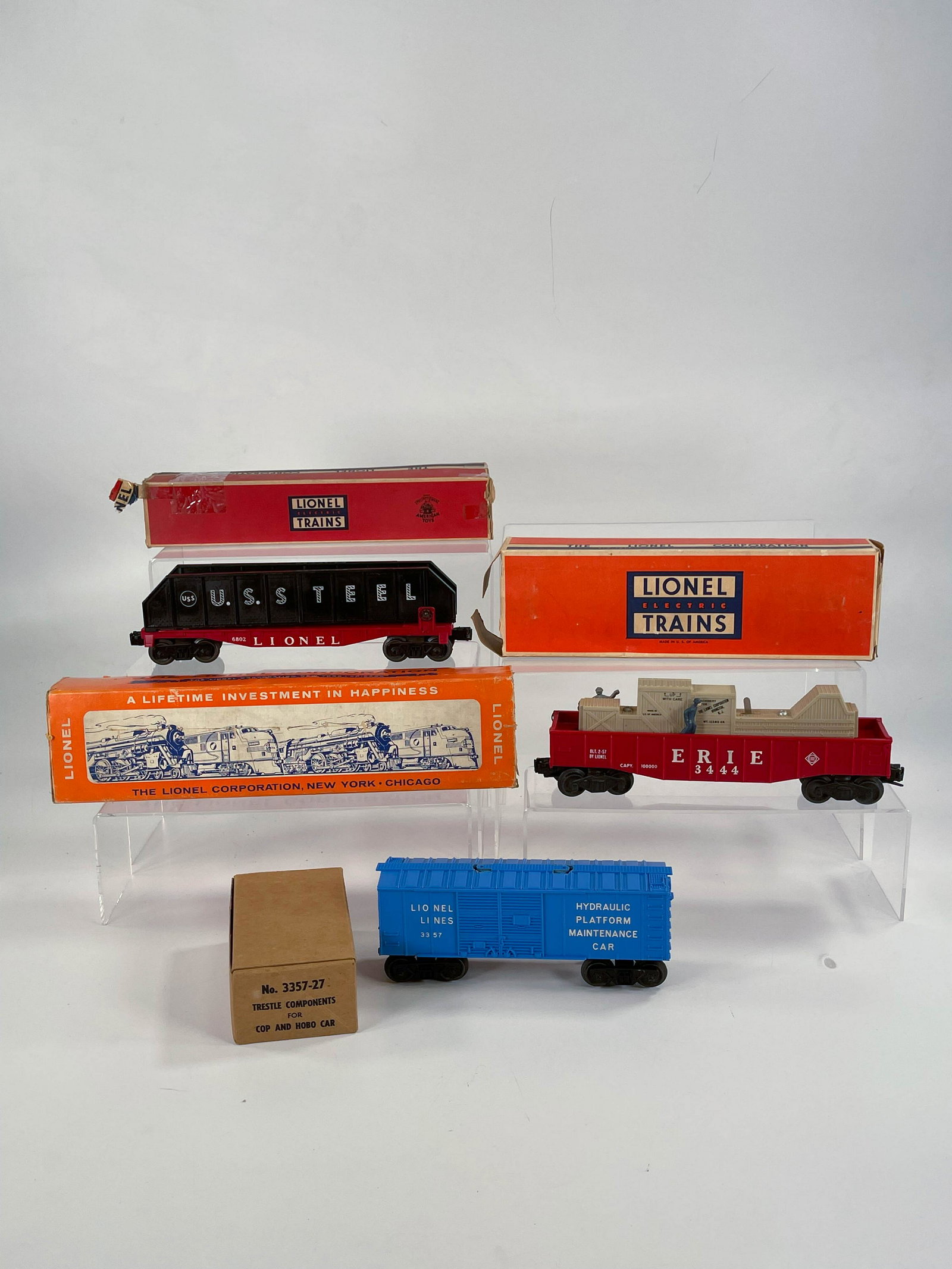 Lionel #3357 Hydraulic Platform Maintenance Car, #6802: Lionel #3357 Hydraulic Platform Maintenance Car, #6802 Flat Car with Girders and #3444 Animated Gondola Car, with Boxes, with #3444 in C5 based on the chip in lower part of one side of body (see photo