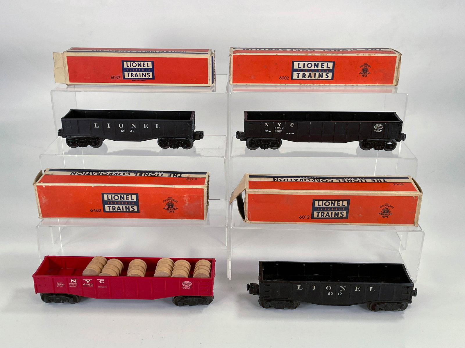 Lionel Postwar #6002 Black Hopper, #6032 Black Hopper,: Lionel Postwar #6002 Black Hopper, #6032 Black Hopper, #6462 Red Hopper and #6012 Black Hopper, with all Hoppers in C7 to C7 plus and all boxes missing at least one end.