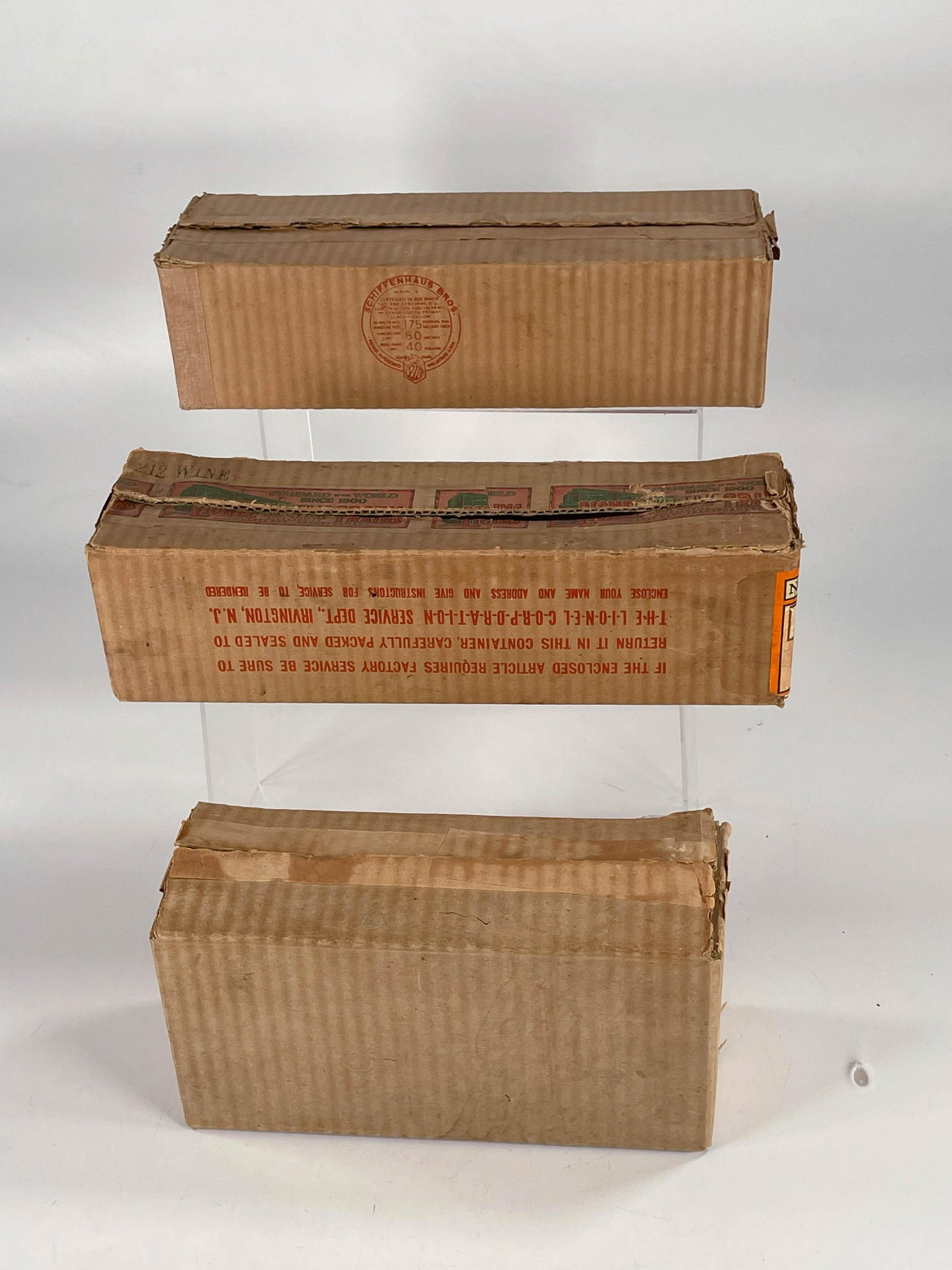 Lionel Prewar original boxes only #212 Gondola, #384T: Lionel Prewar original boxes only #212 Gondola, #384T black tender and #220 search light car, with all flaps present on all three boxes. This lot is for boxes only and no content.