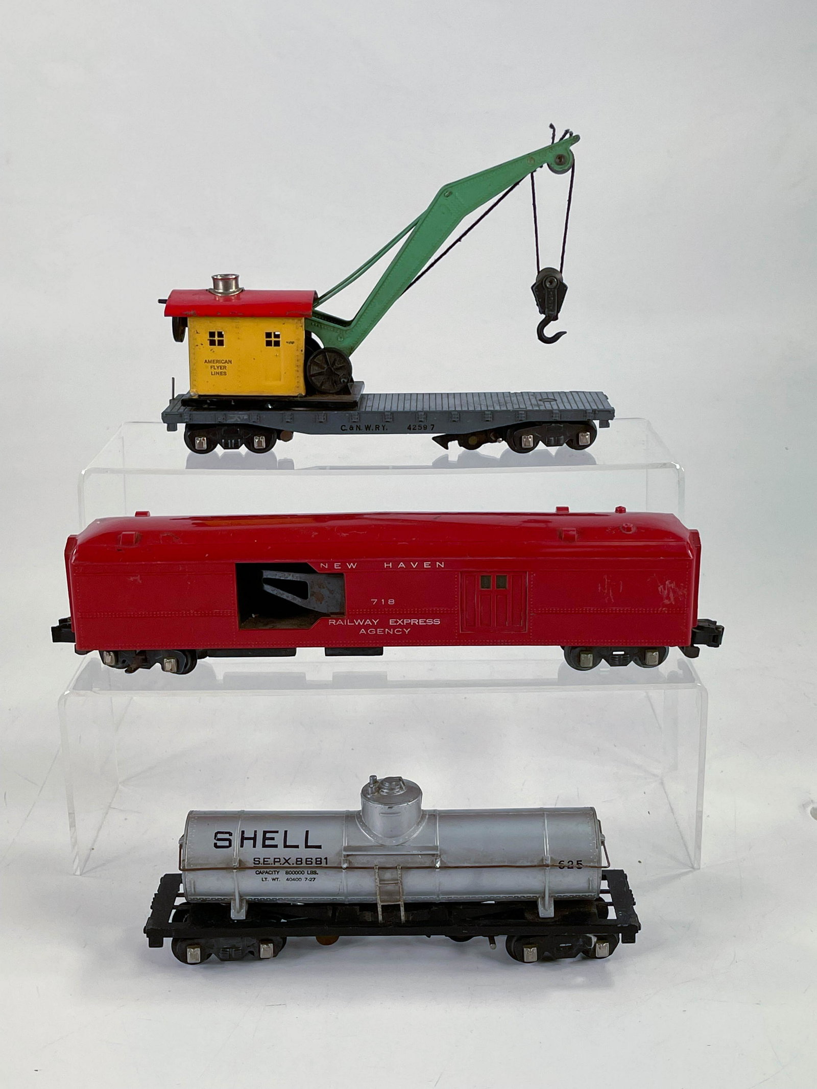American Flyer Prewar #718 New Haven baggage car,: American Flyer Prewar #718 New Haven baggage car, #42597 crane car and #625 tank car, with the #625 in C7, the #718 in C5 because of a chip at one lower corner of the car and #42597 in C6 minus with o