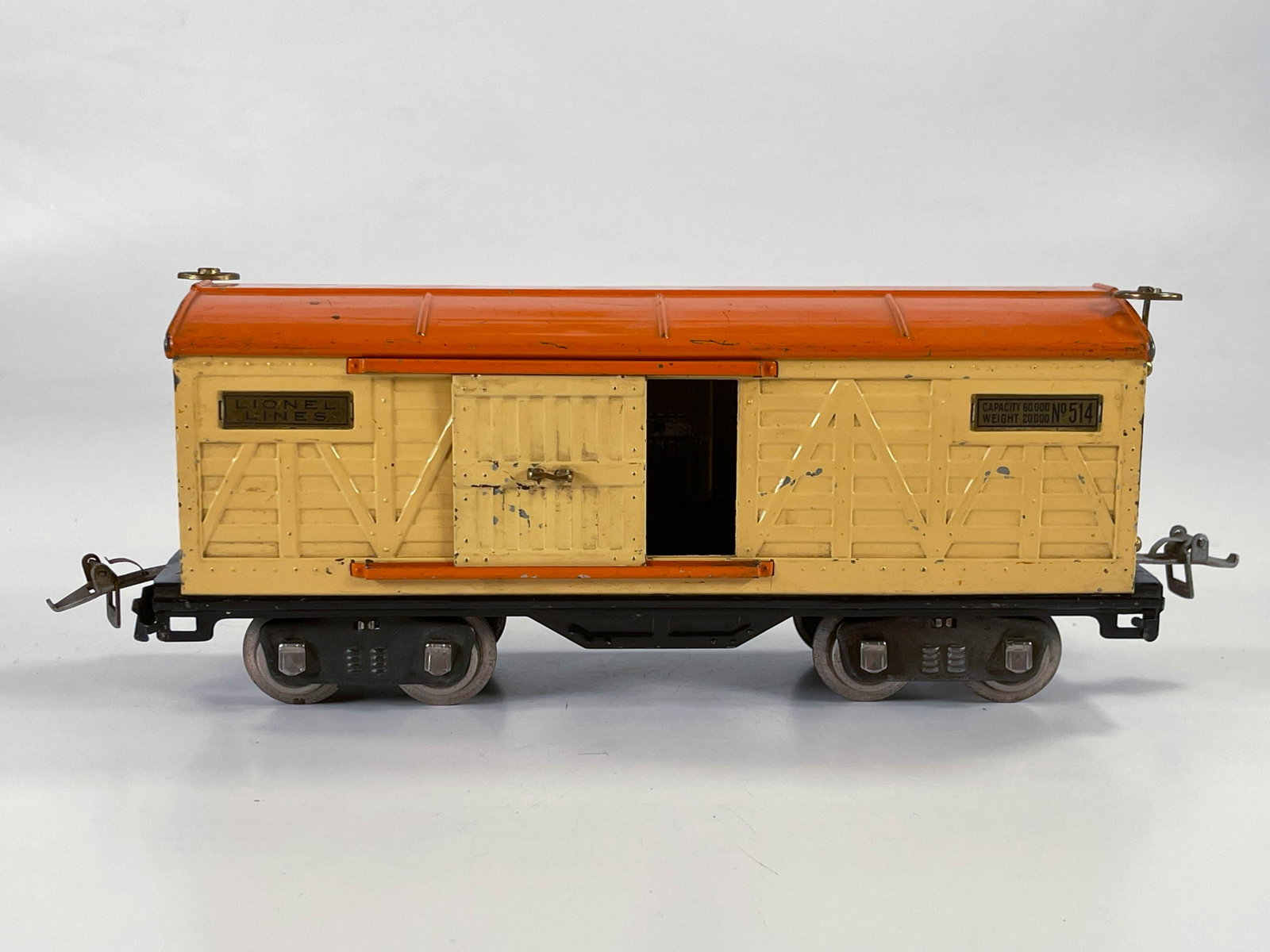 Lionel Prewar #514 Box car with cream sides and orange: Lionel Prewar #514 Box car with cream sides and orange roof, in C6 minus.