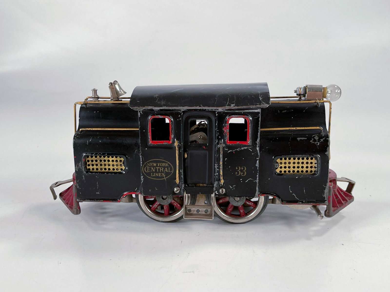 Lionel Prewar #33 electric in black: Lionel Prewar #33 electric locomotive in black, with some scratches on the side making it in C5 plus plus condition and roof has two corner bends giving it a C5 rating.