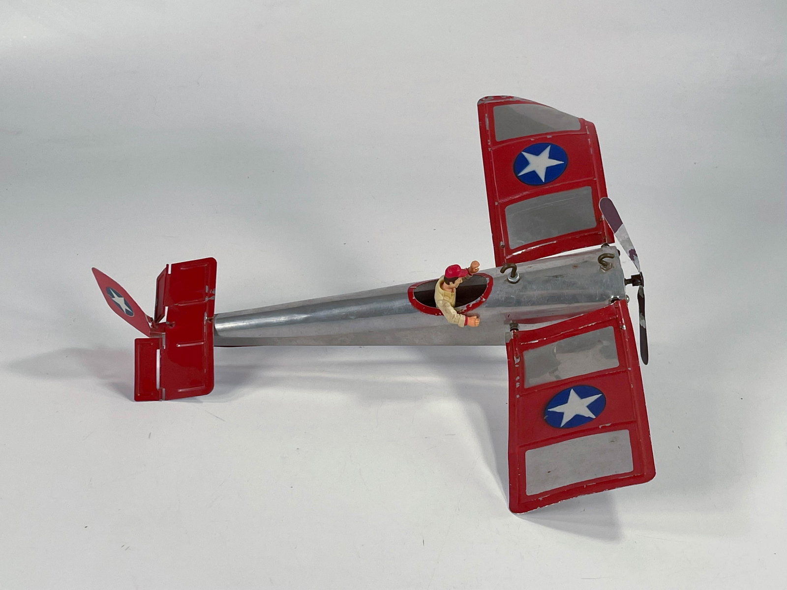 Antique monoplane in silver and red: Antique monoplane in silver and red, in C6 with a slight bend on one of the wings.