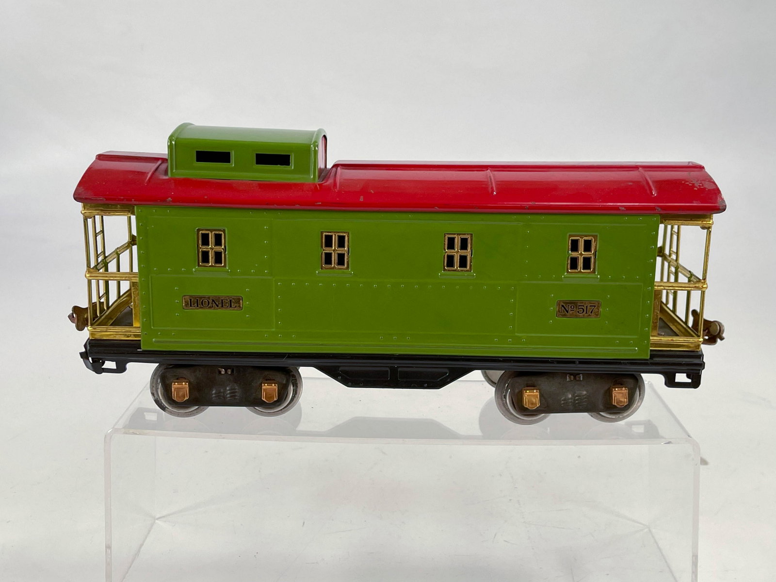 Lionel Prewar #517 caboose with pea green/red roof: Lionel Prewar #517 caboose with pea green/red roof, with the #517 in C7 minus except for a small touch up on a paint loss area on the roof [see photos].