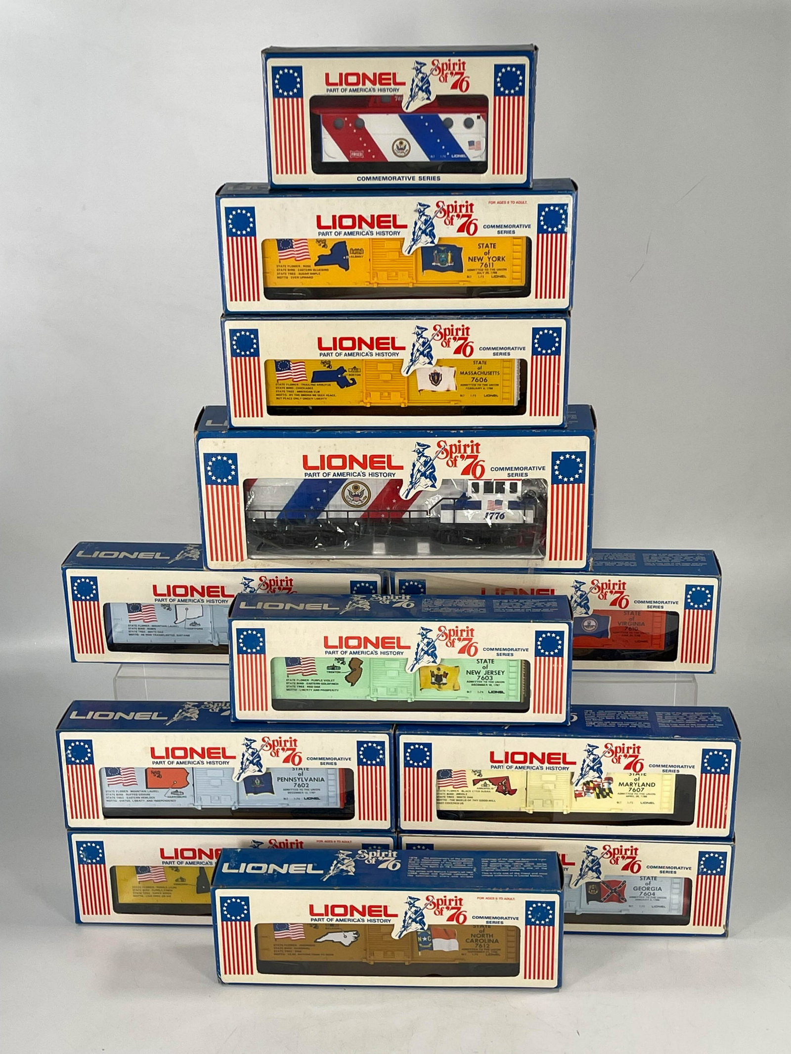 MPC Lionel O Gauge Spirit of '76 U36B Diesel #6-1776: MPC Lionel O Gauge Spirit of '76 U36B Diesel #6-1776 with Twelve (12) Spirt of '76 Freight Cars all boxed, in C8.