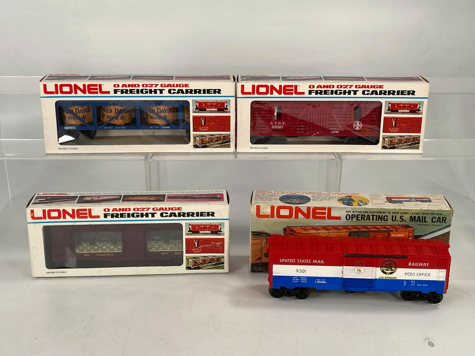 MPC Lionel O Gauge Freight Cars in Original Boxes X 4: MPC Lionel O Gauge Freight Cars in Original Boxes X 4, including operating US Mail Car, Gold Bullion Car, Mogen David Wine Car and Horse Transport Car, all in C8.